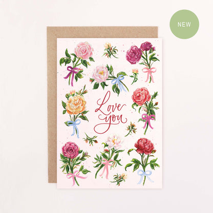 Greeting card with English garden rose floral design, coloured bows and 'Love you' text on a white background