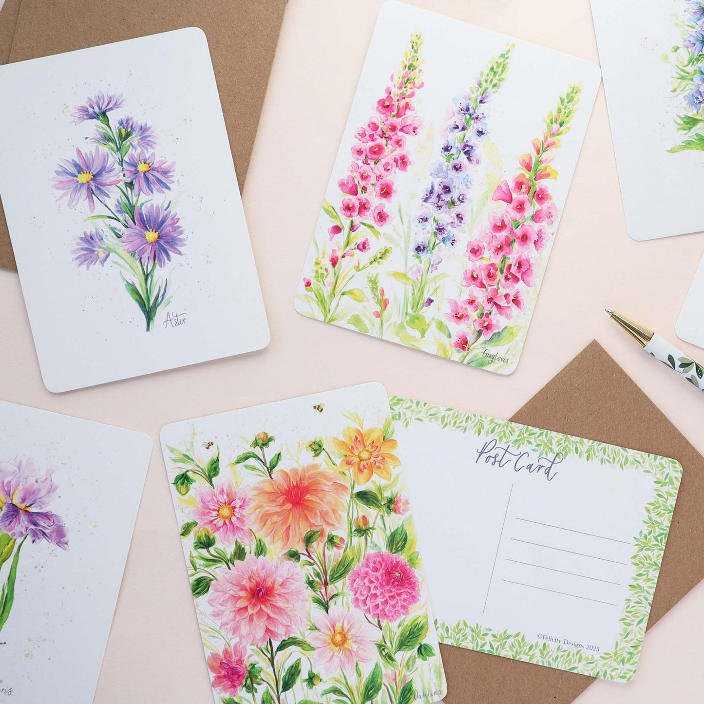 A floral mix of postcards featuring Foxgloves, Dahlias, Aster, Larkspur and Iris. 