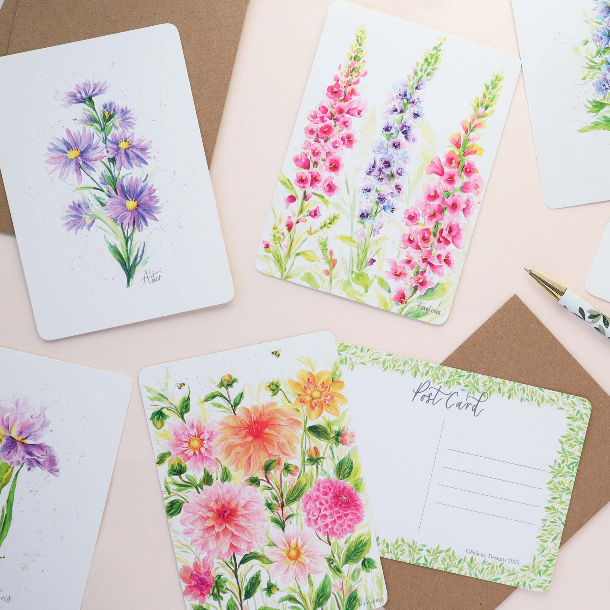 A floral mix of postcards featuring Foxgloves, Dahlias, Aster, Larkspur and Iris. 