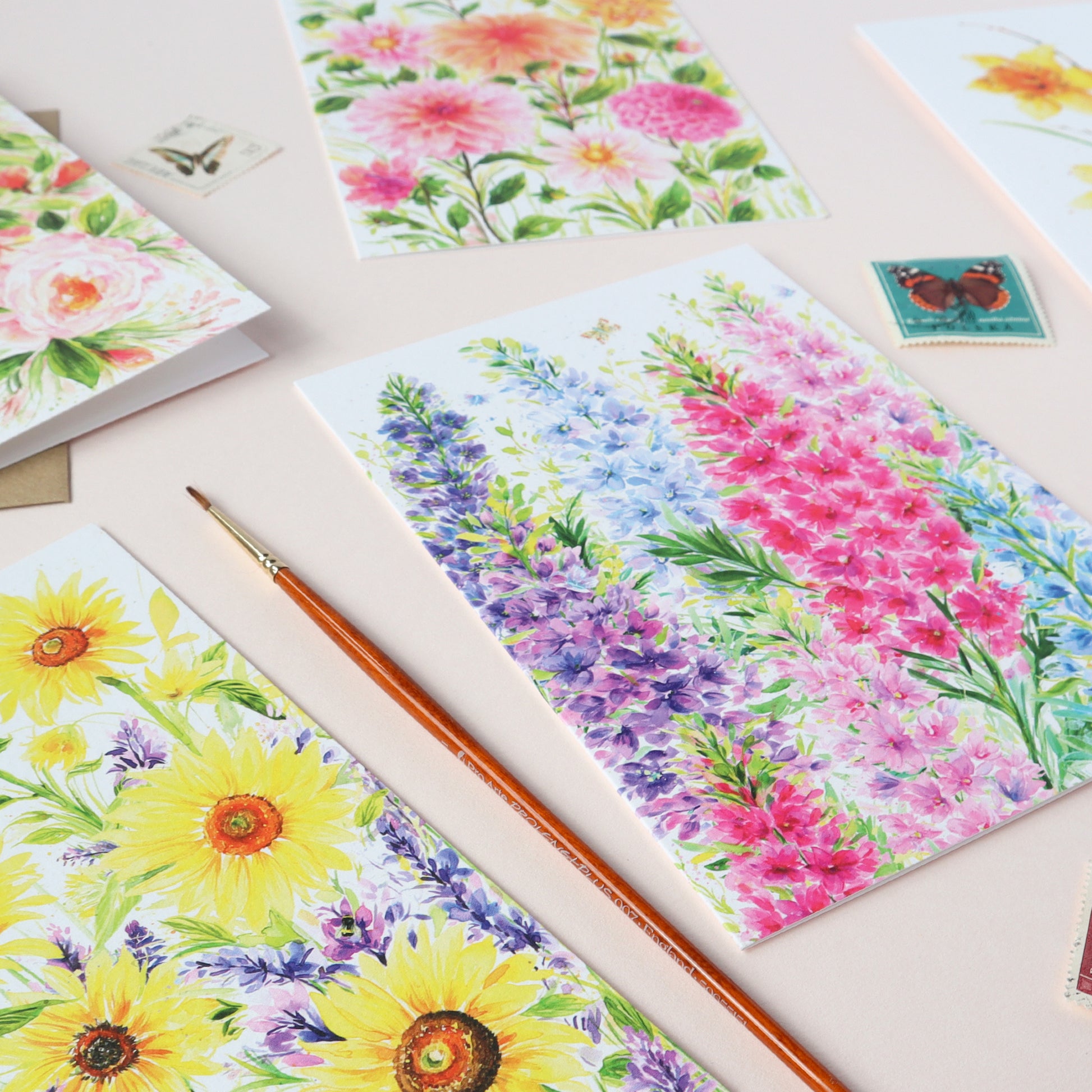 Colourful Floral greeting cards displaying Dahlias. foxgloves, delphiniums and trailing roses